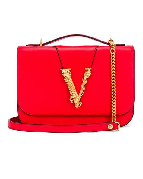 red versace bag with lock okn side